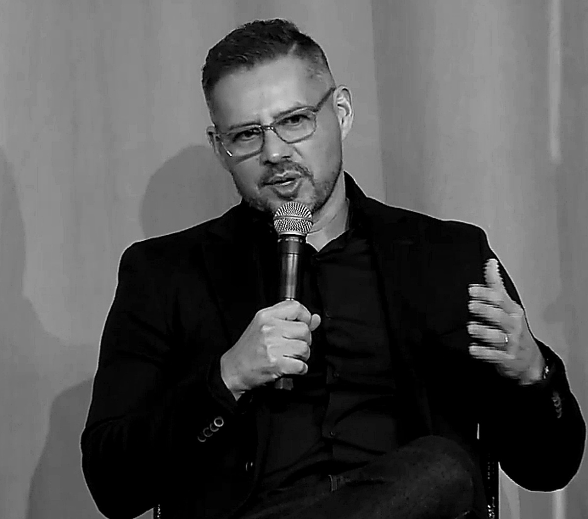 Eric Ayala speaking at an InsurTech conference